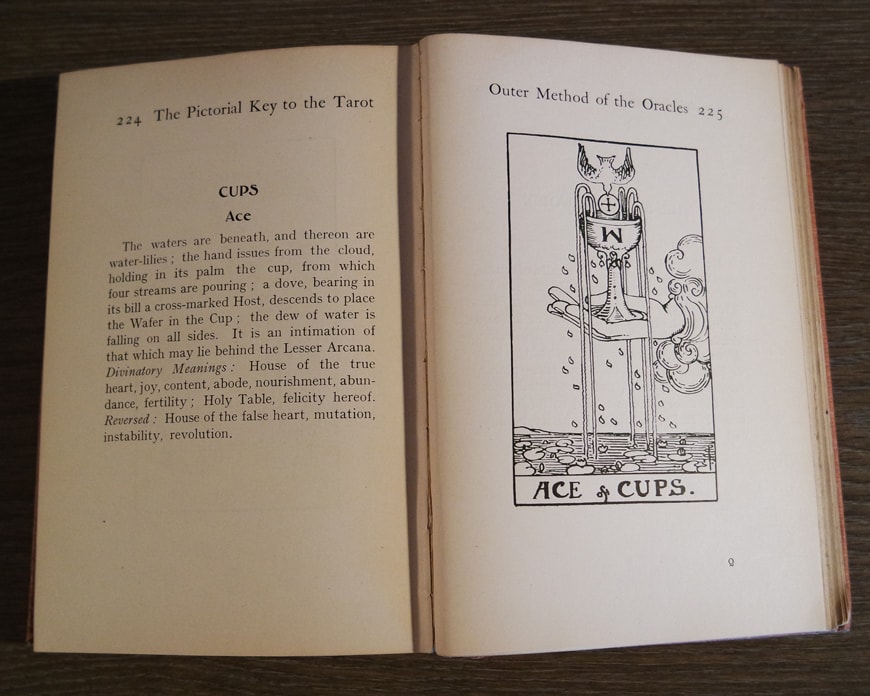 Tarot book open to Ace of Cups